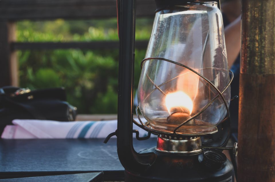 a lantern on a window ledge in a haunted house