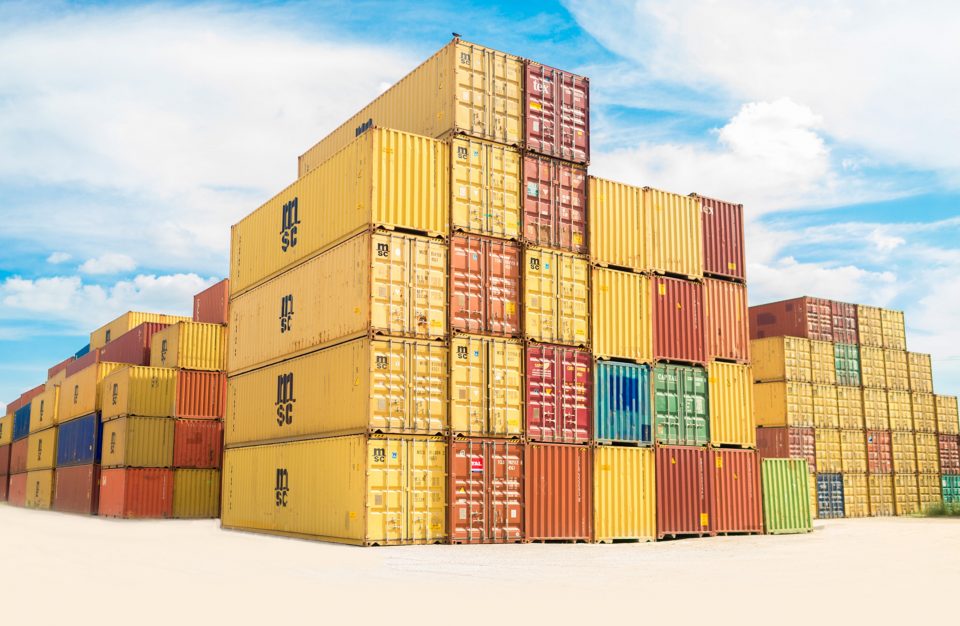 a stack of moving pods containers in a shipping yard