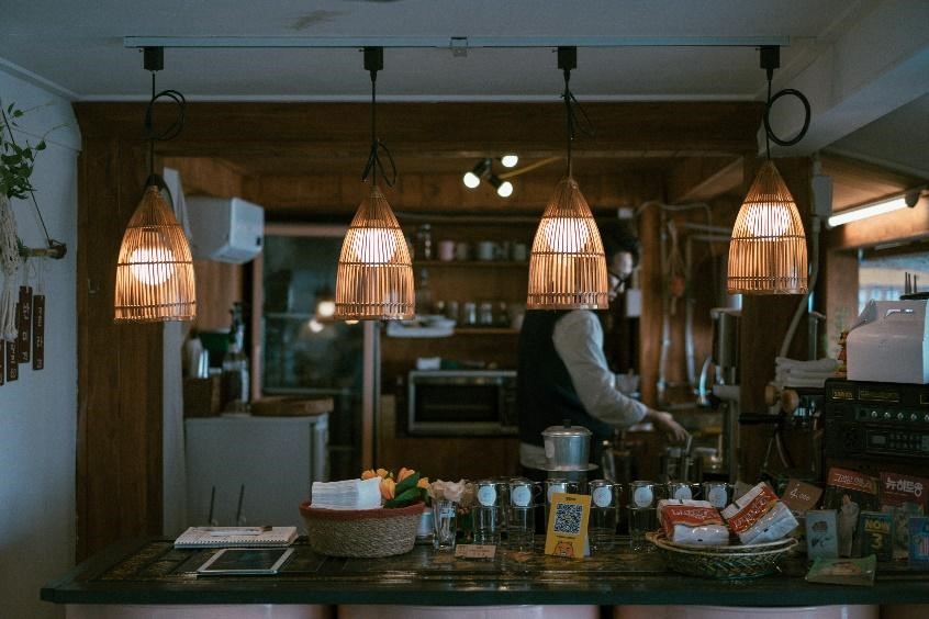 a set of hanging pendant lights above a kitchen countertop