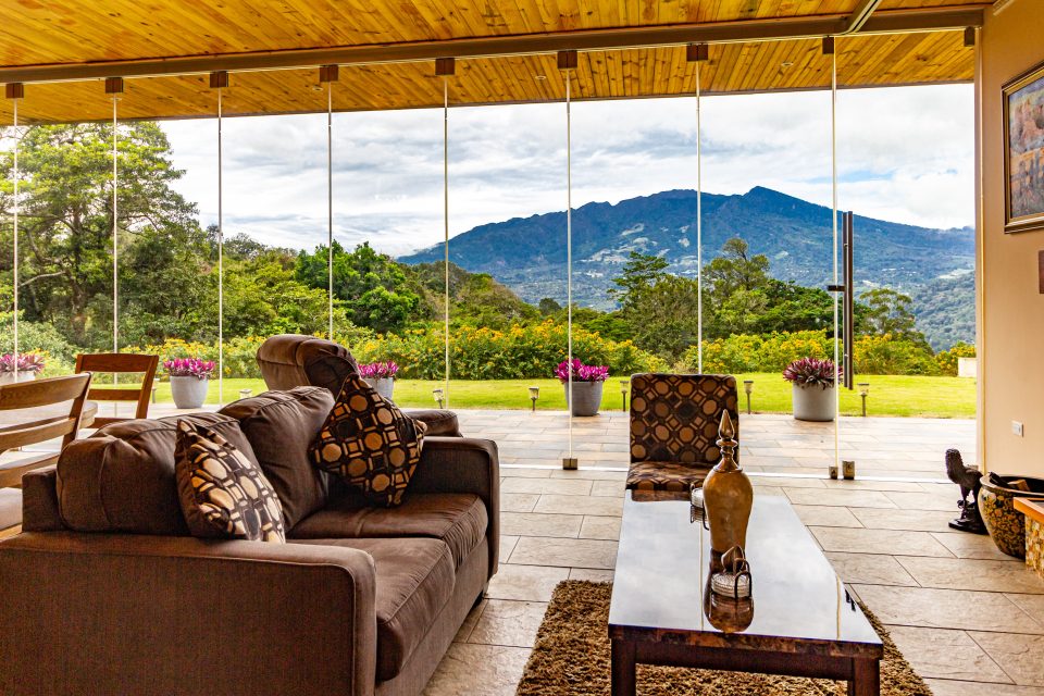 a property interior with large windows and mountain views