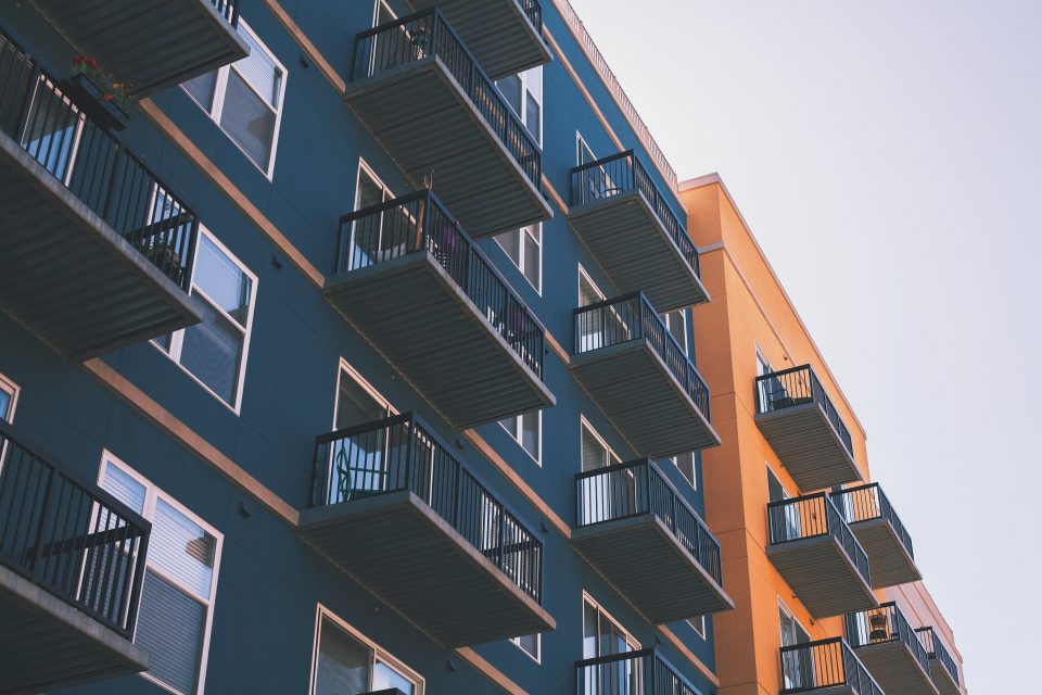 navy and orange apartment buildings with balconies