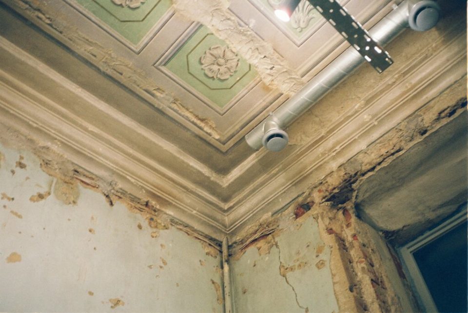 a house interior with black mold on the walls and ceiling