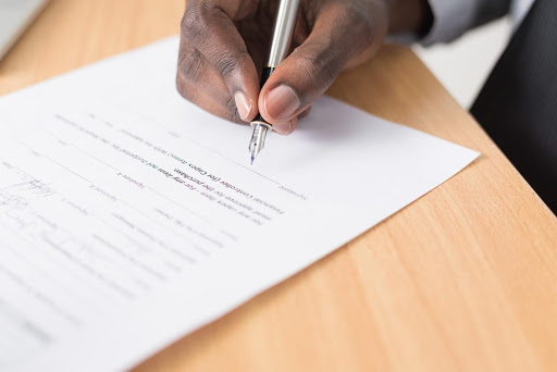 a person signing a contract to terminate a lease