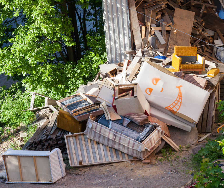 a trash pile spilling out of a hoarder house