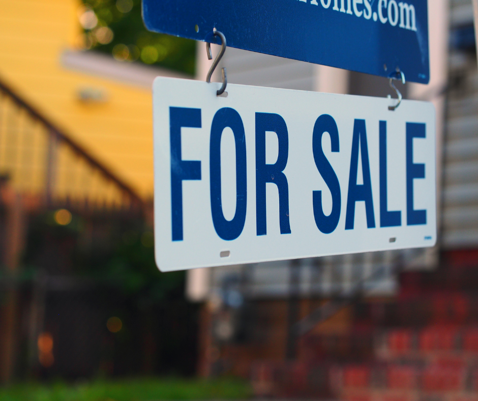 a for sale sign outside a property