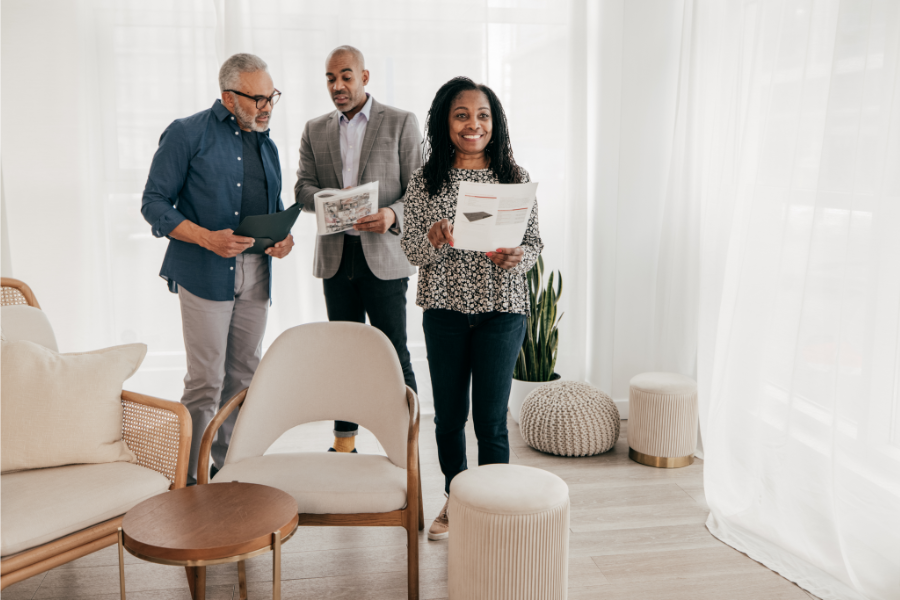 a couple and a real estate agent viewing an uncluttered house