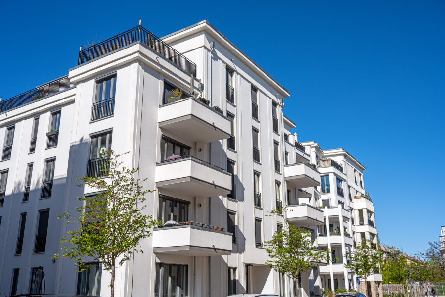 a white multi-family property building