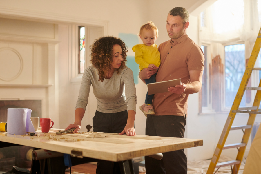 a couple with baby planning a home improvement project