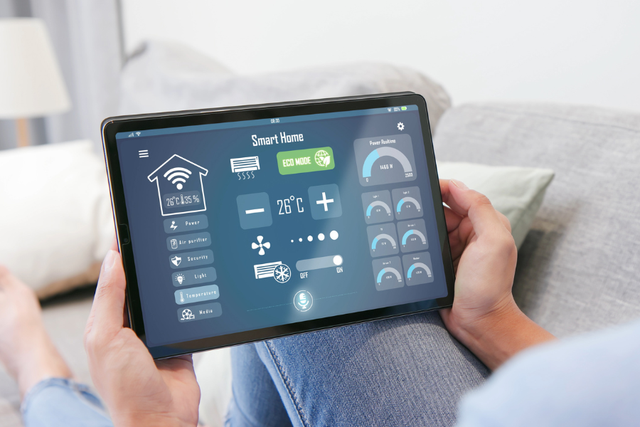 a person monitoring smart home systems via a tablet