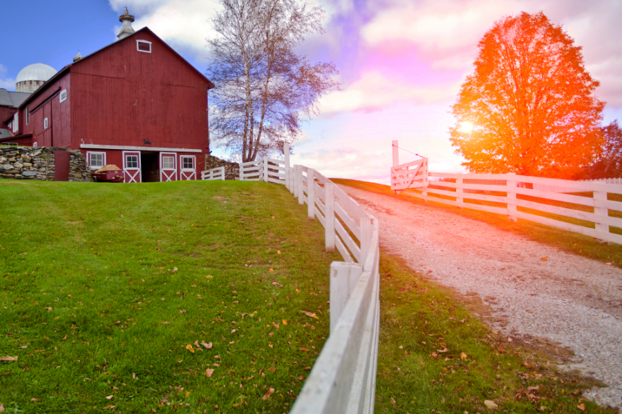 a farmhouse with acres of land