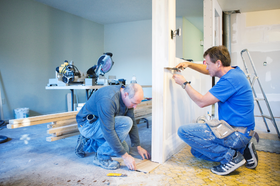 two men renovating a property