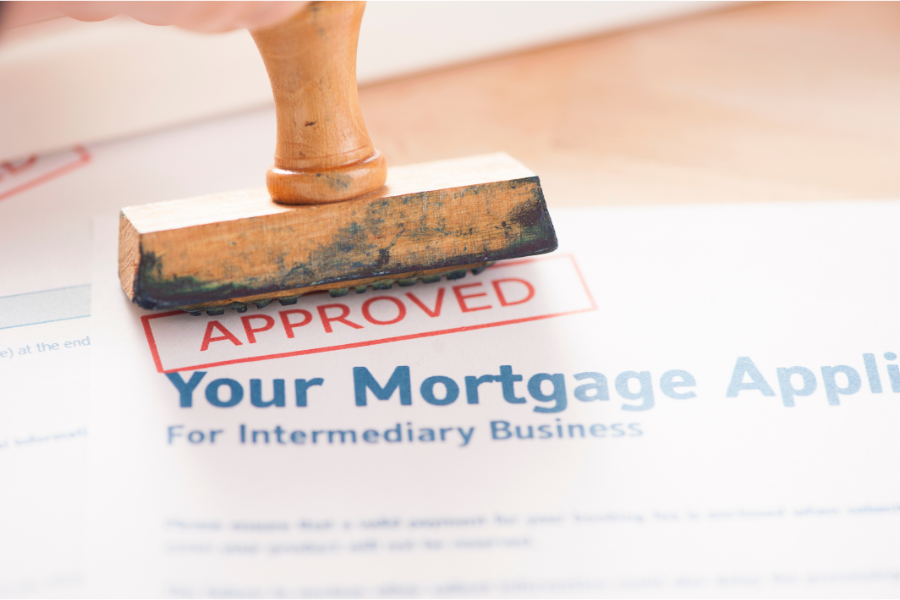 a mortgage closing costs application being stamped with an approval stamp