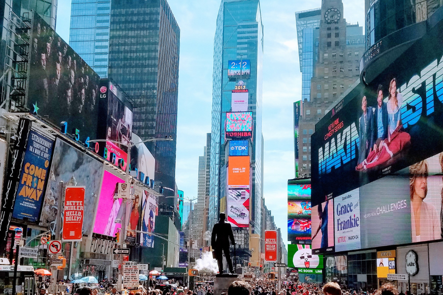 a crowd in new york city times square