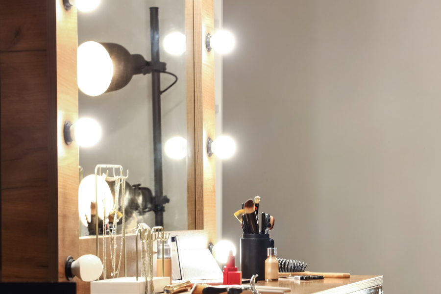 a dressing table mirror with lights