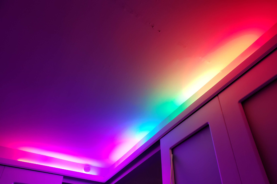 colorful smart home lighting above kitchen cupboards